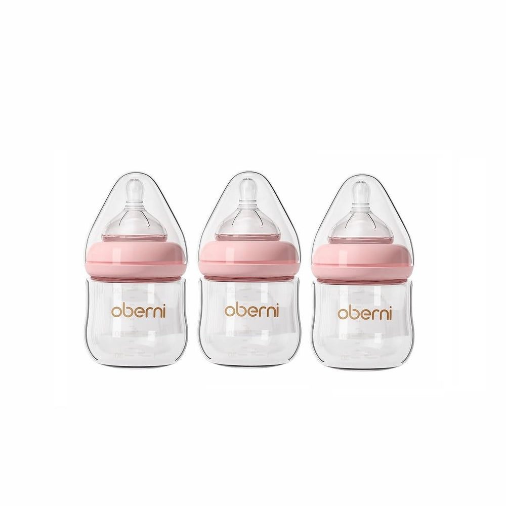 Oberni glass baby bottle close-up shows anti-colic system for smoother feeds.
