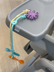 Octopal Baby Tether Straps 3-pack displayed on table to illustrate mess-free mealtime.