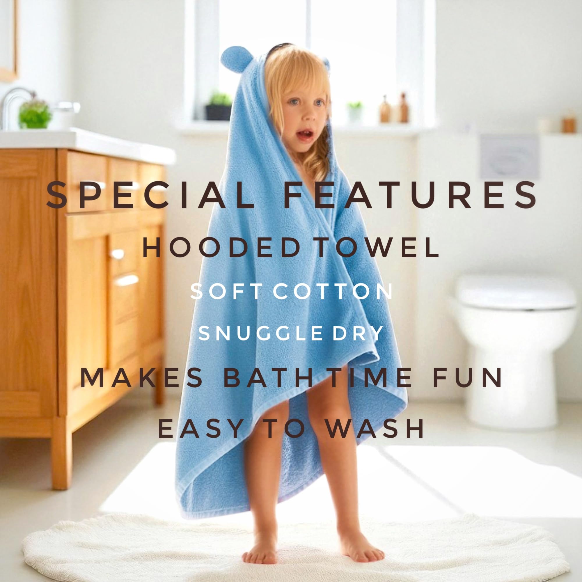 odaa kid drying off after-swim with absorbent coral poncho towel