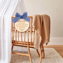 OENIZI blue sign laser-engraved on natural wood for durability