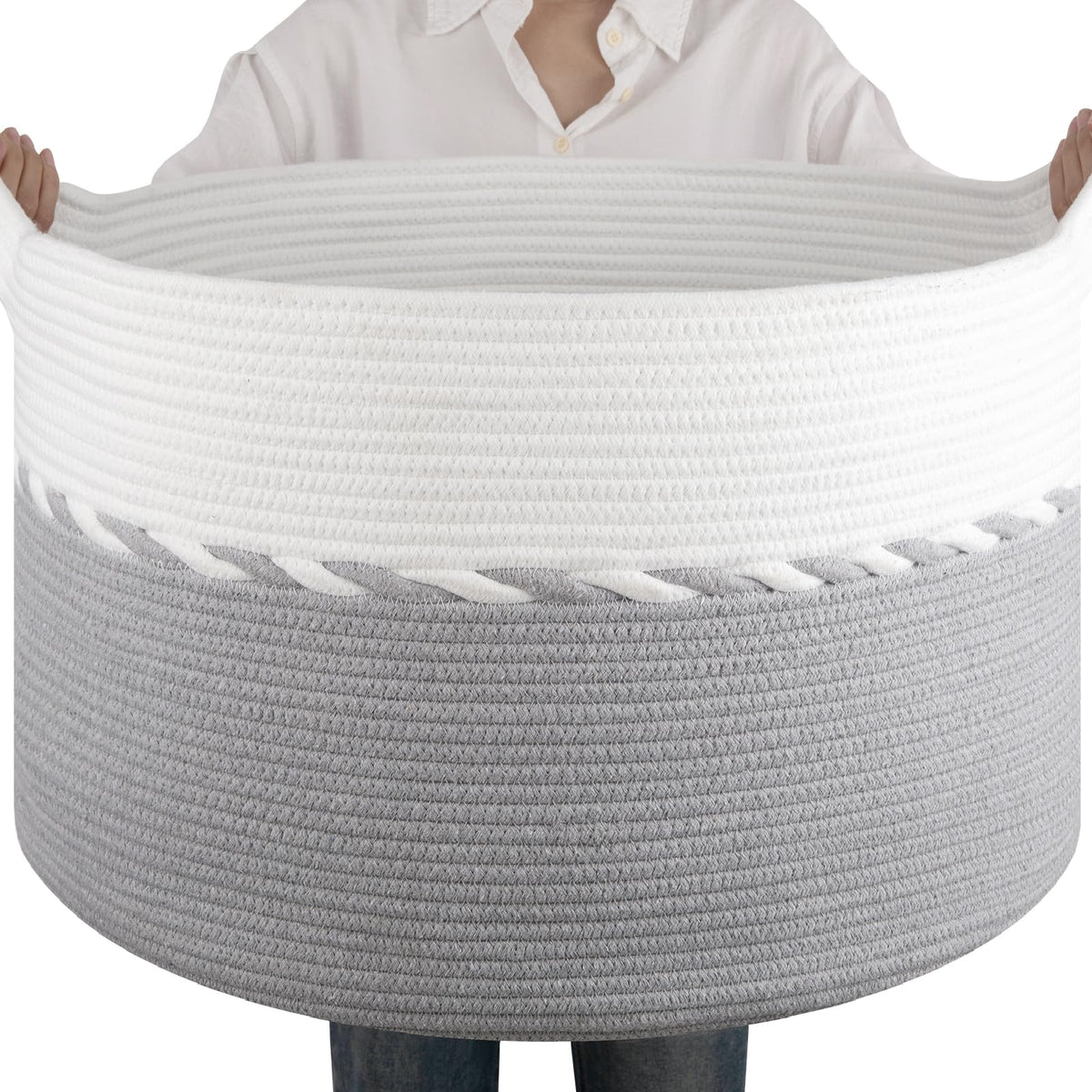 OIAHOMY blanket basket gray-white in living room for organized storage.