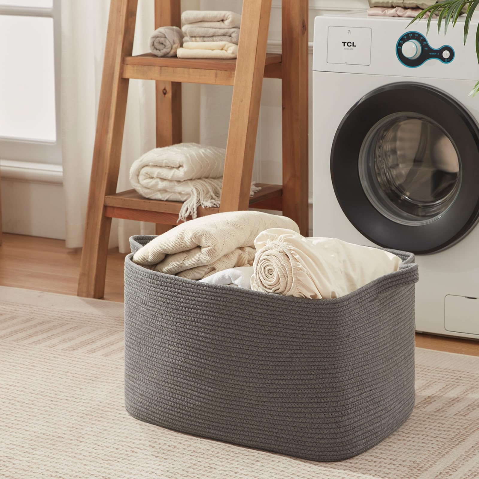 OIASKET 118L basket with toys in living room for tidy organization.