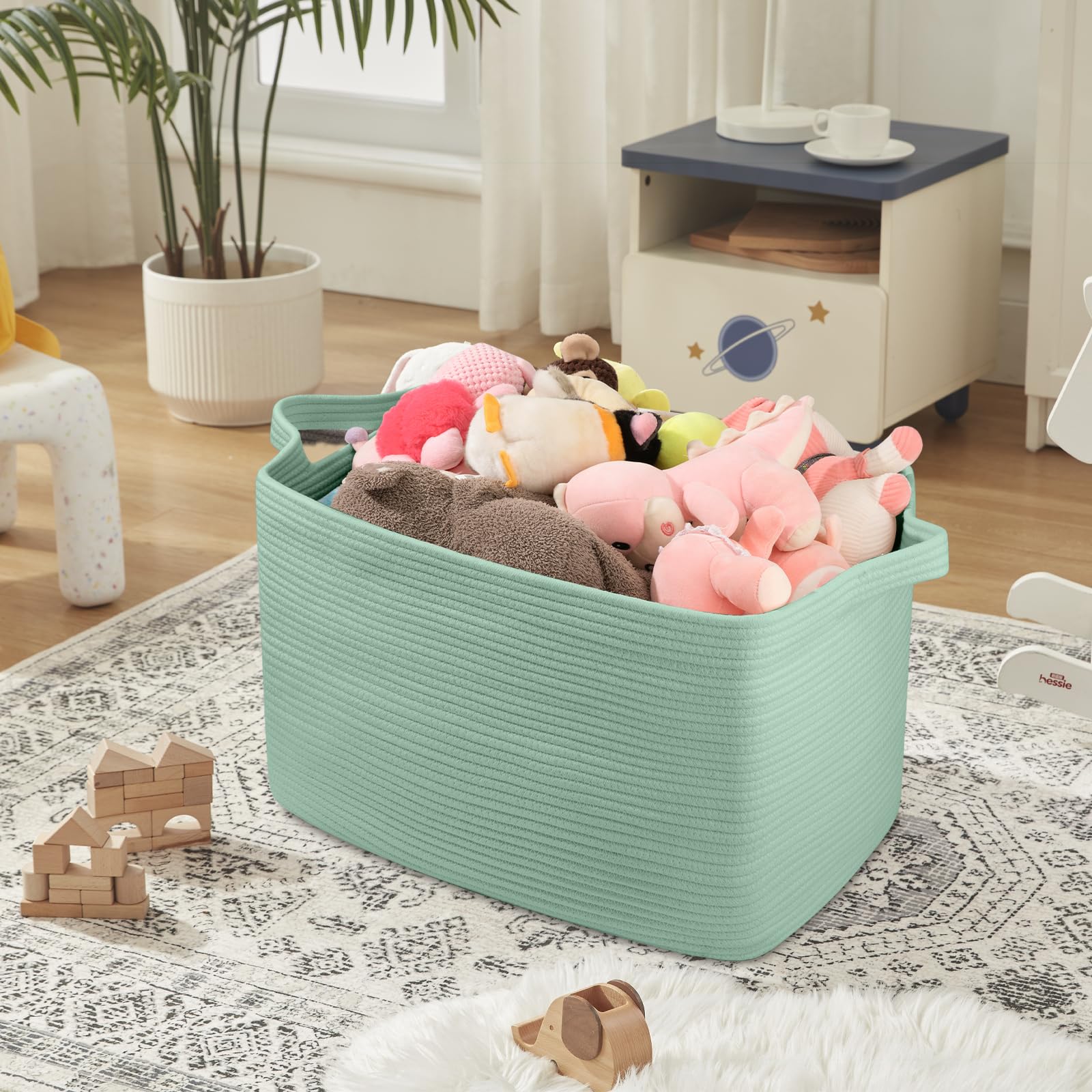 OIASKET 95L blanket basket filled with blankets for quick organization in any room.