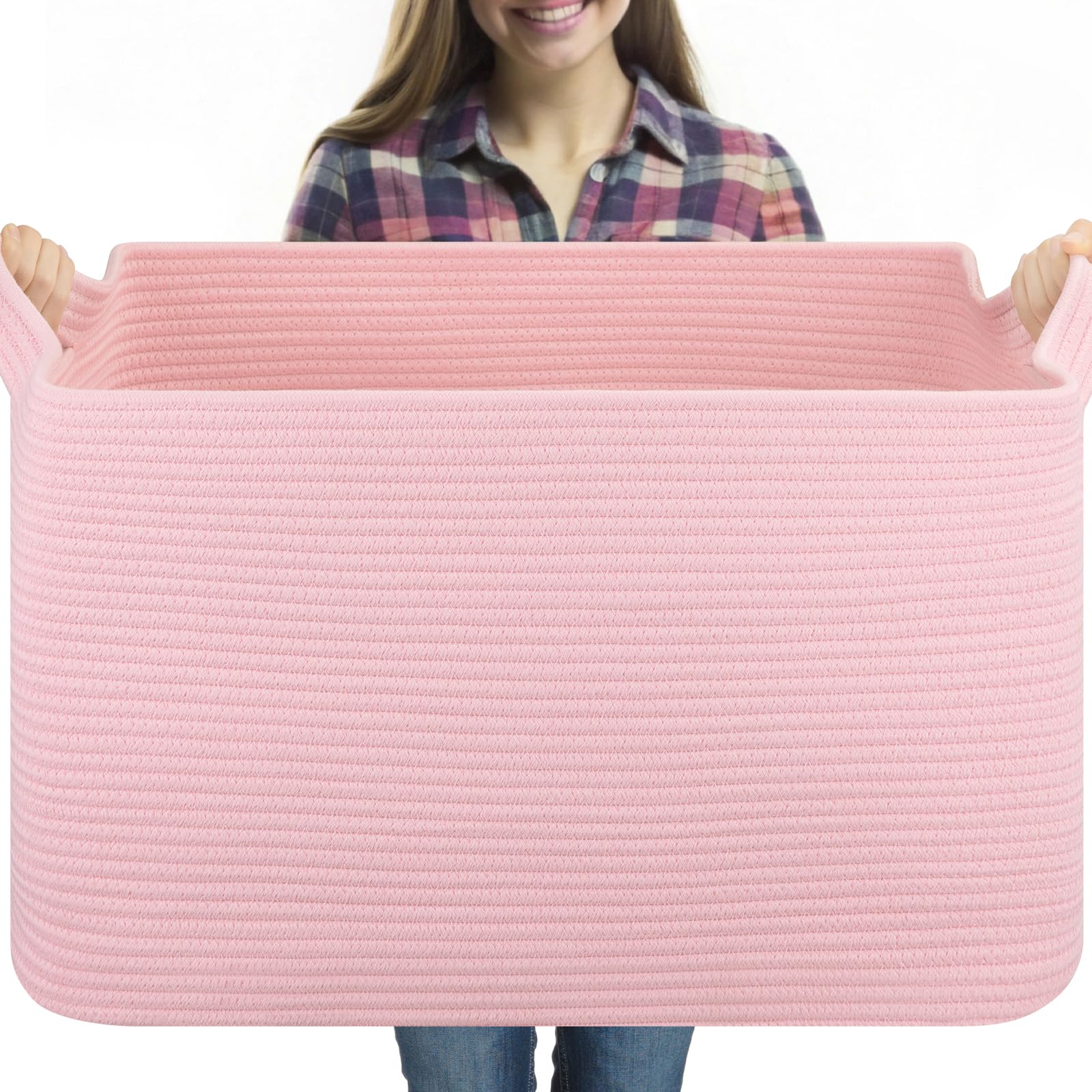 OIASKET 95L blanket basket on living room floor storing blankets and pillows for easy access.