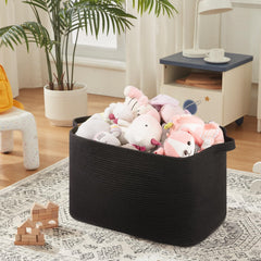 OIASKET 118L basket placed in living room demonstrates versatile storage for blankets or toys.