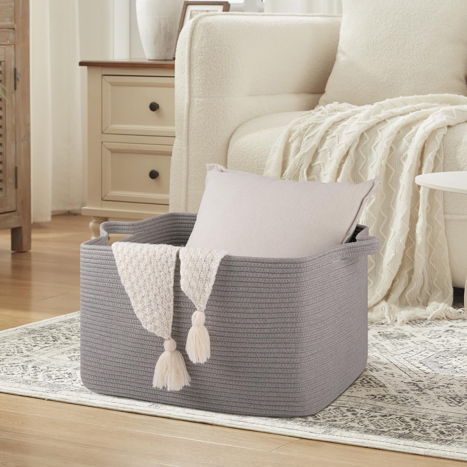 OIASKET storage basket helps organize towels and clothes in a tidy bedroom or bathroom.