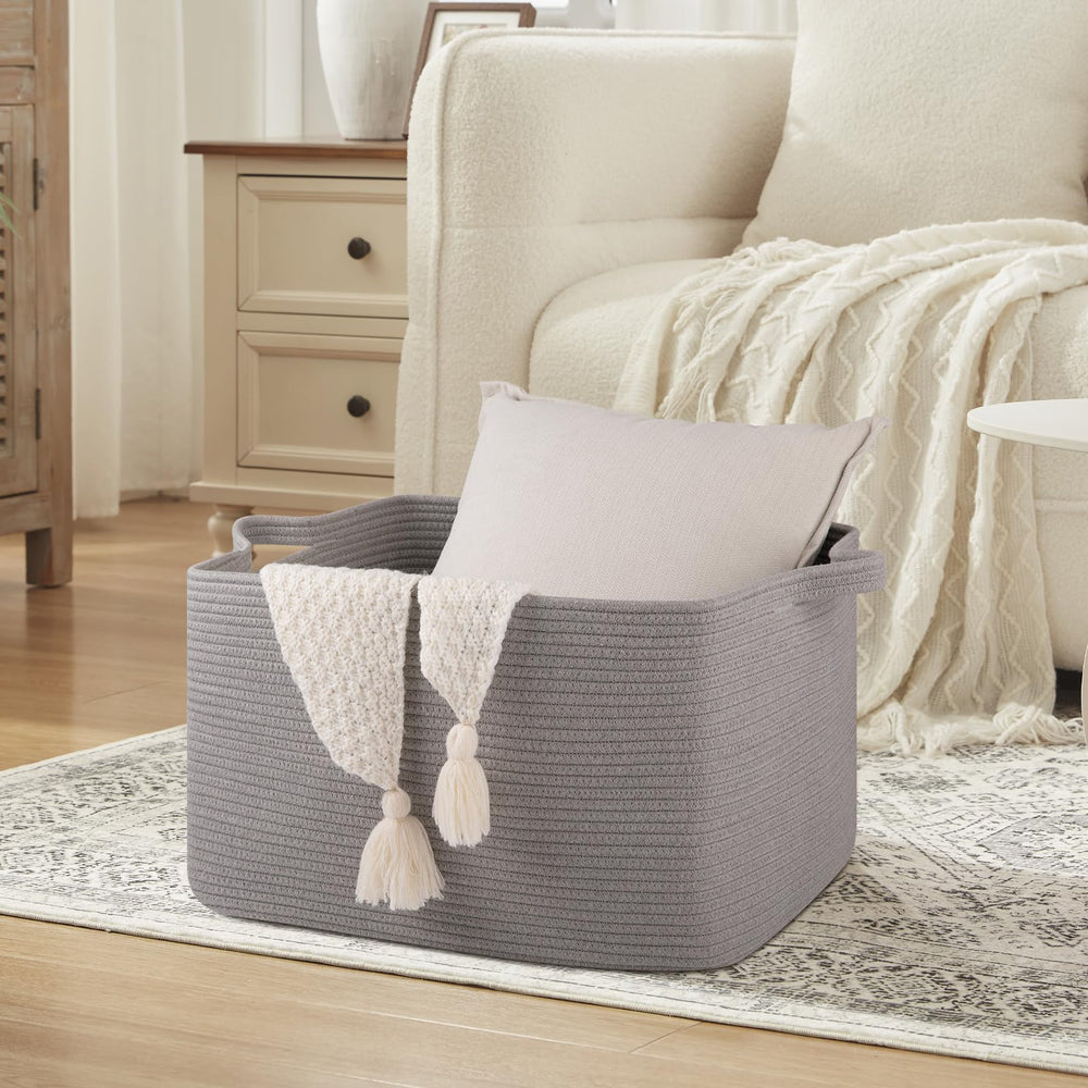 OIASKET storage basket helps organize towels and clothes in a tidy bedroom or bathroom.