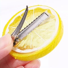 OIUUBBII Lemon Girls Bow Clip closeup highlighting soft fabric texture and sunny color
