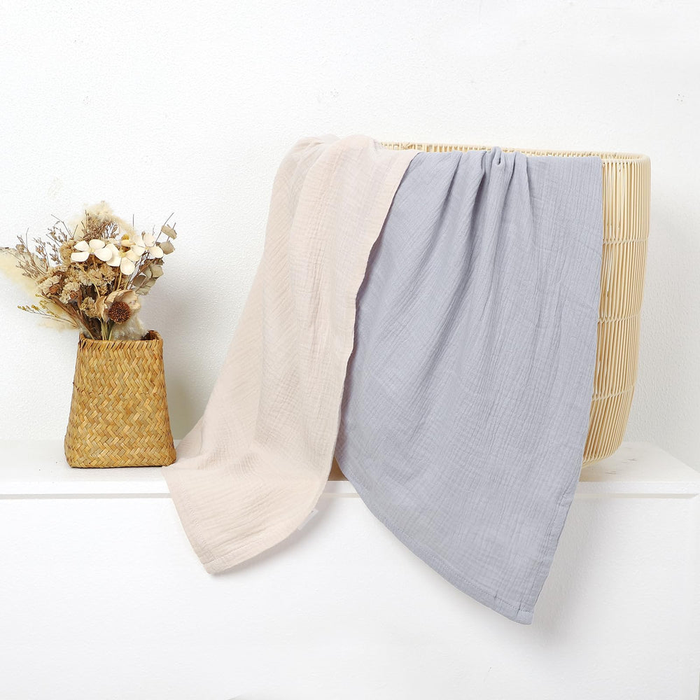 okdiy large 47x47 muslin blanket displayed on crib