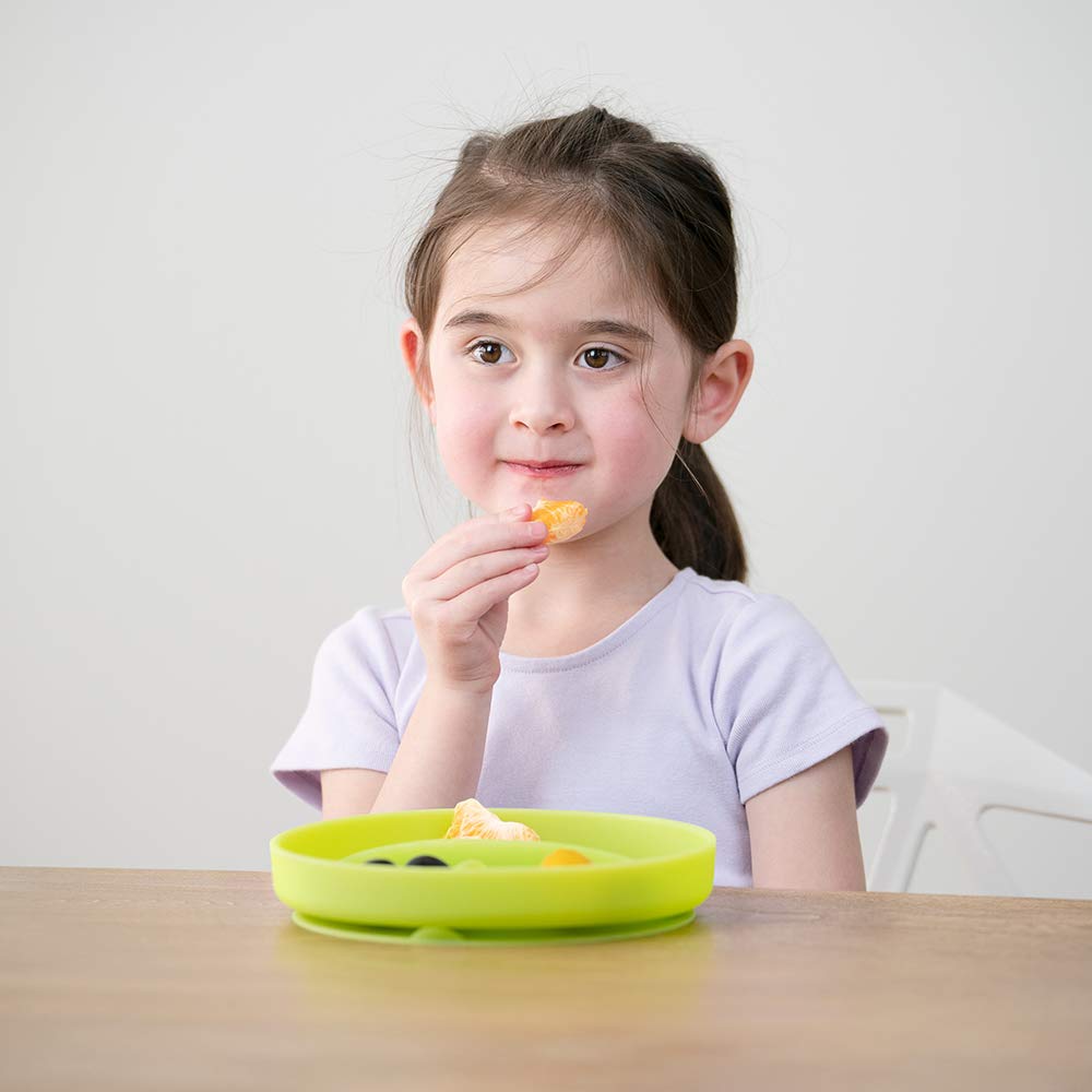 Olababy suction plate on a highchair tray illustrating spill prevention benefits.