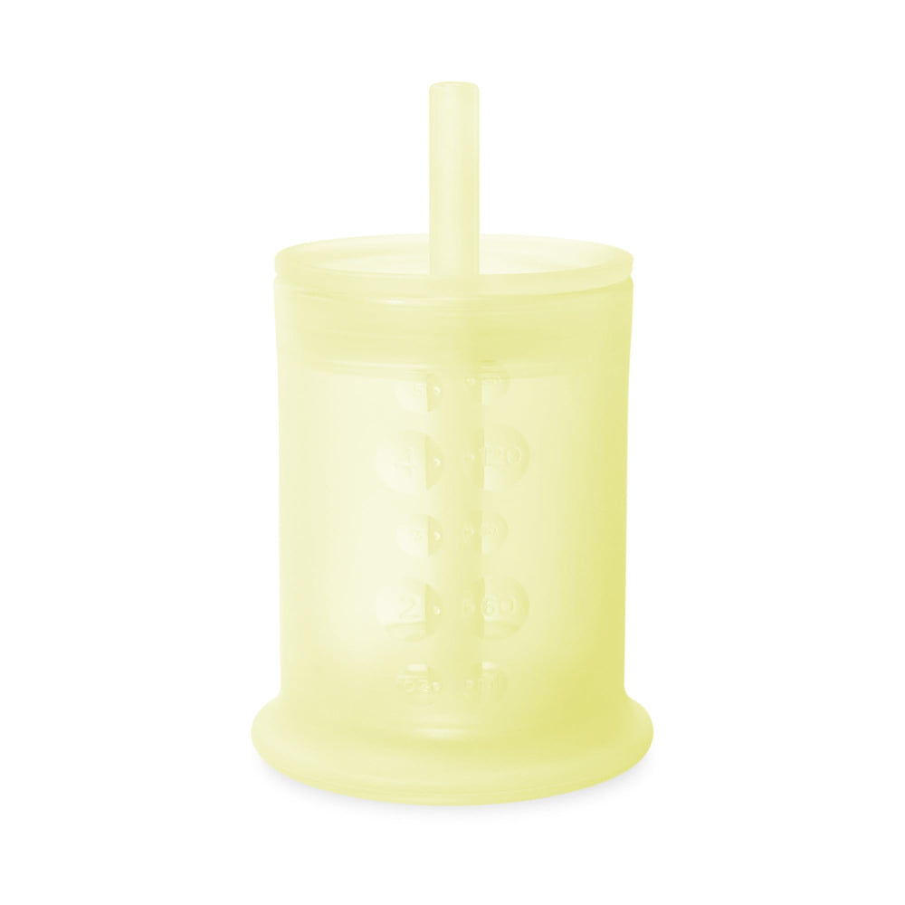 Olababy silicone training cup with straw lid in lemon color supports independent sipping.