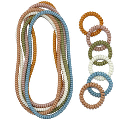 Olugu chewy necklace twelve-pack flatlay, discreet sensory jewelry for focus and calm moments.