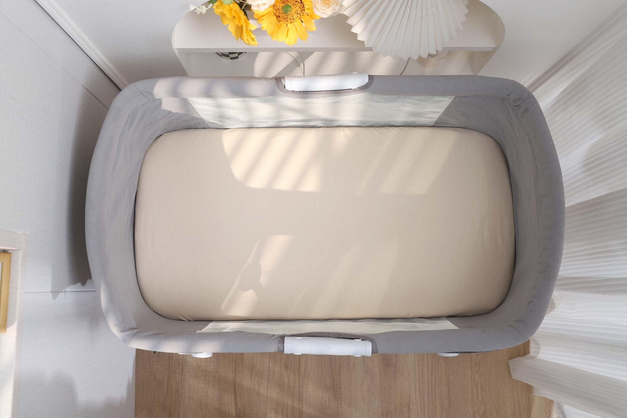 Onacosht bassinet sheet being machine washed—easy care for busy nursery.