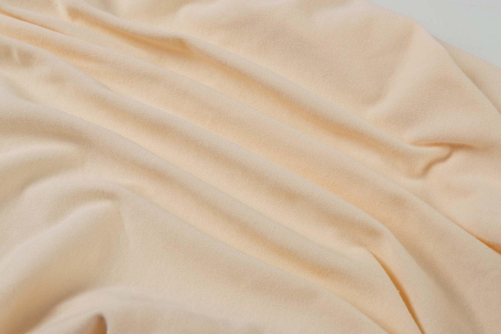 Onacosht fabric close-up—double jersey knit cotton texture for breathable, skin-friendly touch.