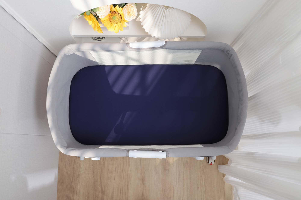Onacosht fog-grey fabric closeup emphasizes neutral tone for unisex nurseries.