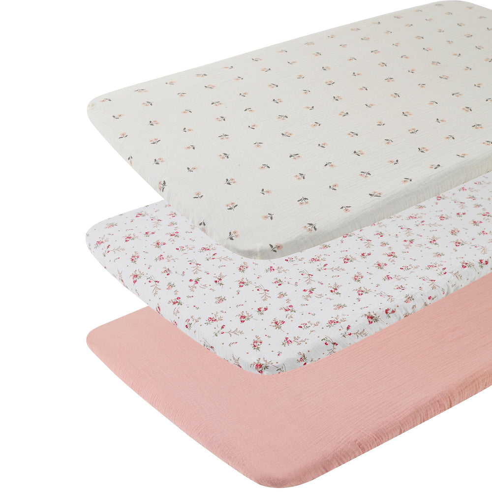 Onacosht muslin sheets shown with 33x17 bassinet for reference.
