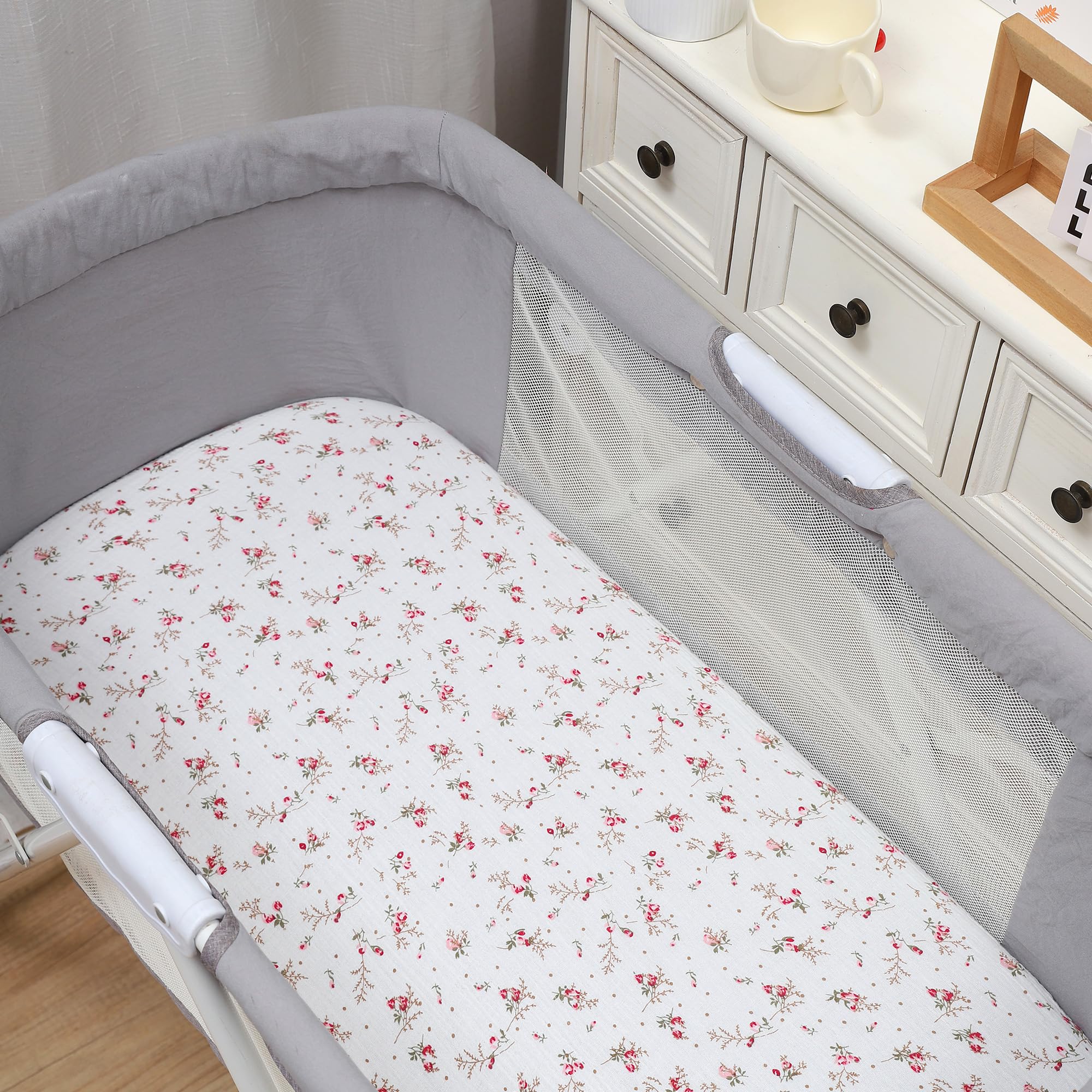 Onacosht pink floral print bassinet sheet adds nursery charm.
