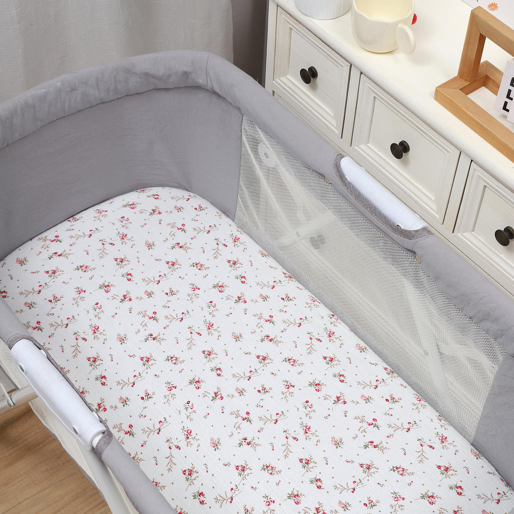 Onacosht pink floral print bassinet sheet adds nursery charm.