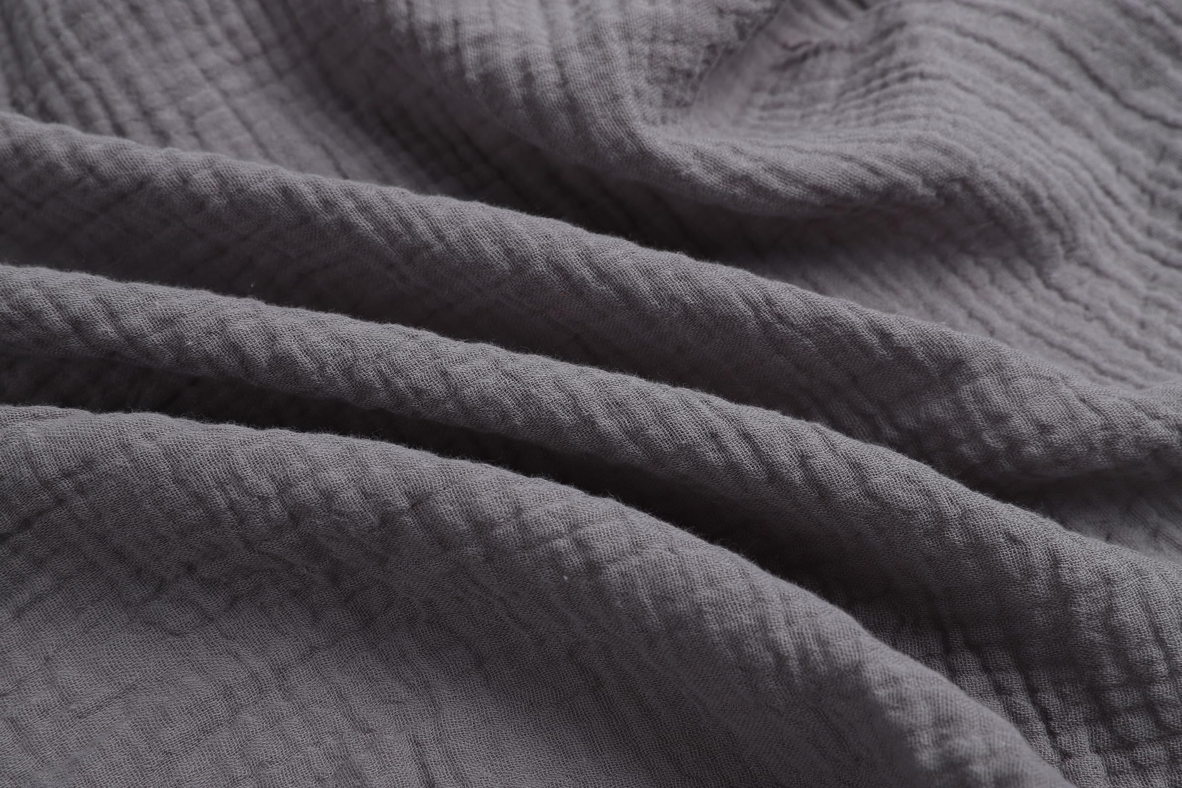 Onacosht close-up shows soft breathable muslin texture ideal for newborn skin.