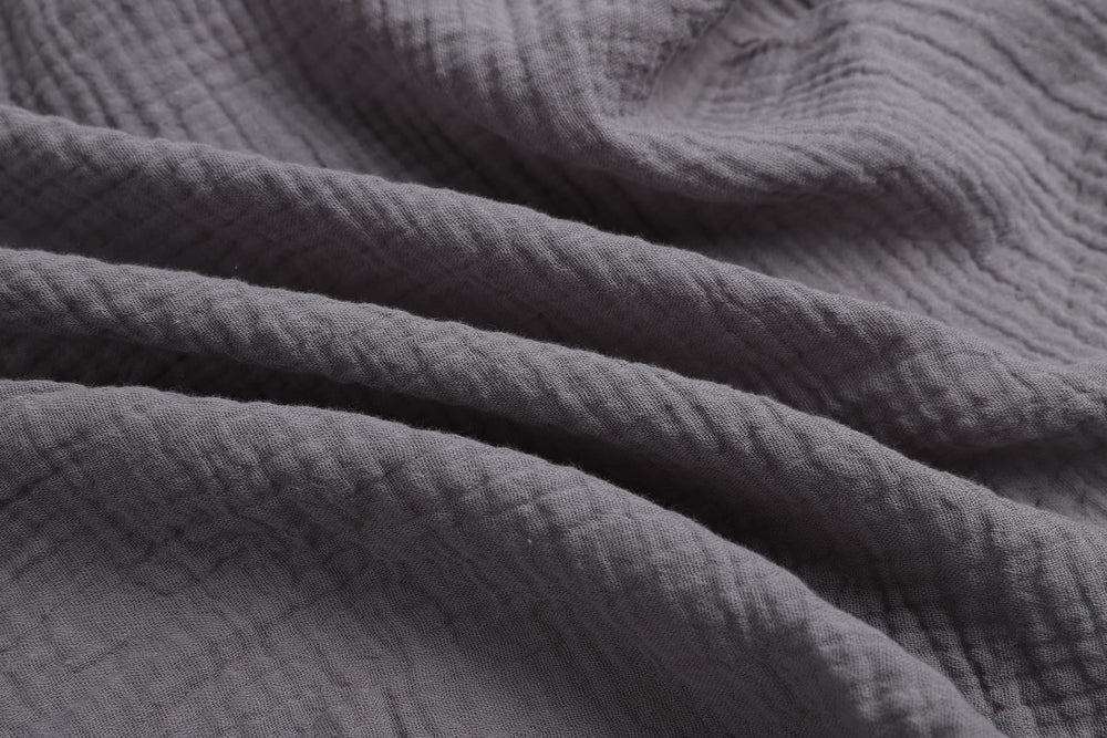 Onacosht close-up shows soft breathable muslin texture ideal for newborn skin.