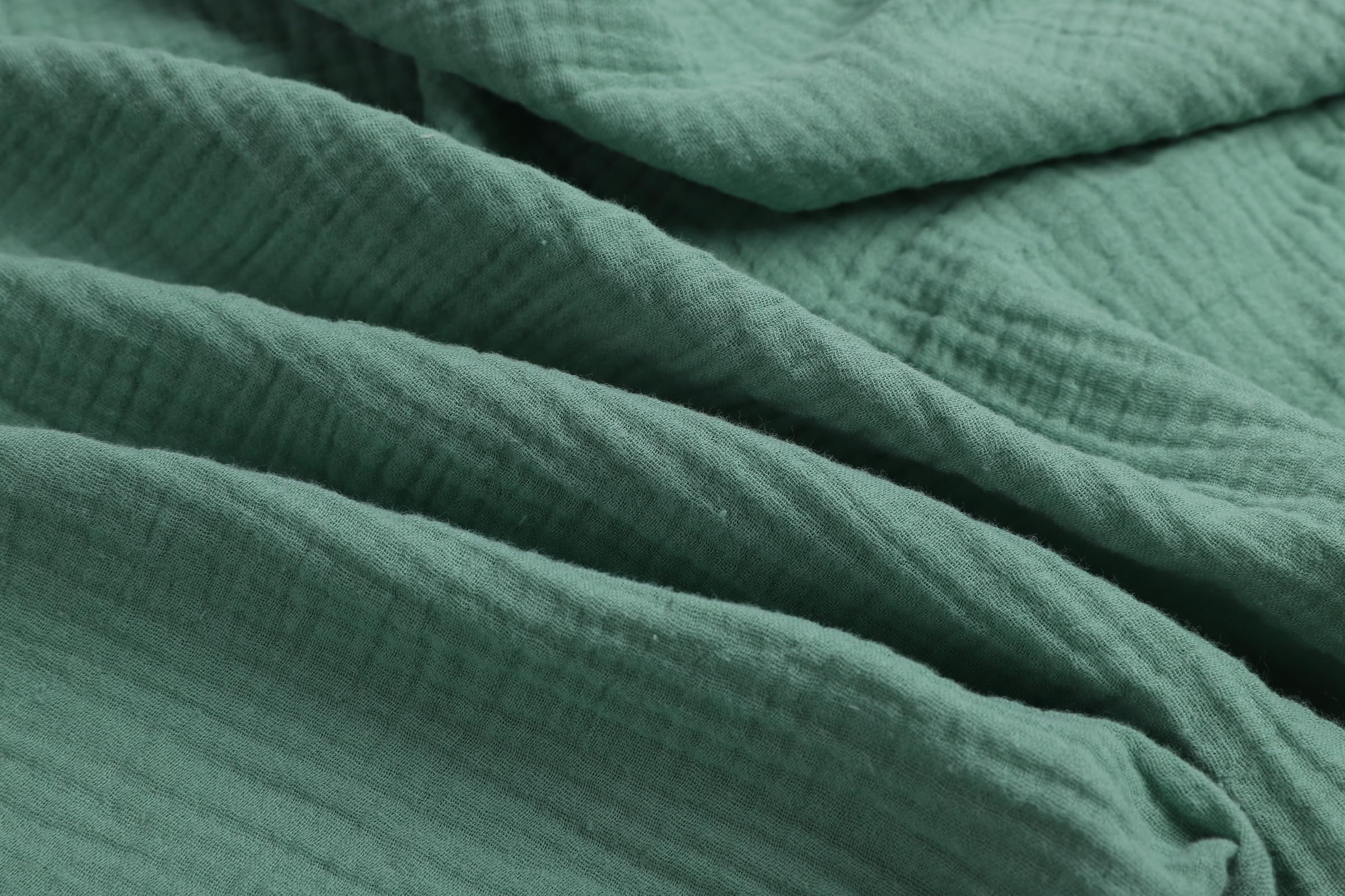 Onacosht muslin bassinet sheets closeup reveals gentle cotton texture for delicate skin.