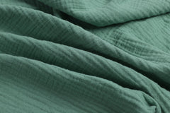 Onacosht muslin bassinet sheets closeup reveals gentle cotton texture for delicate skin.