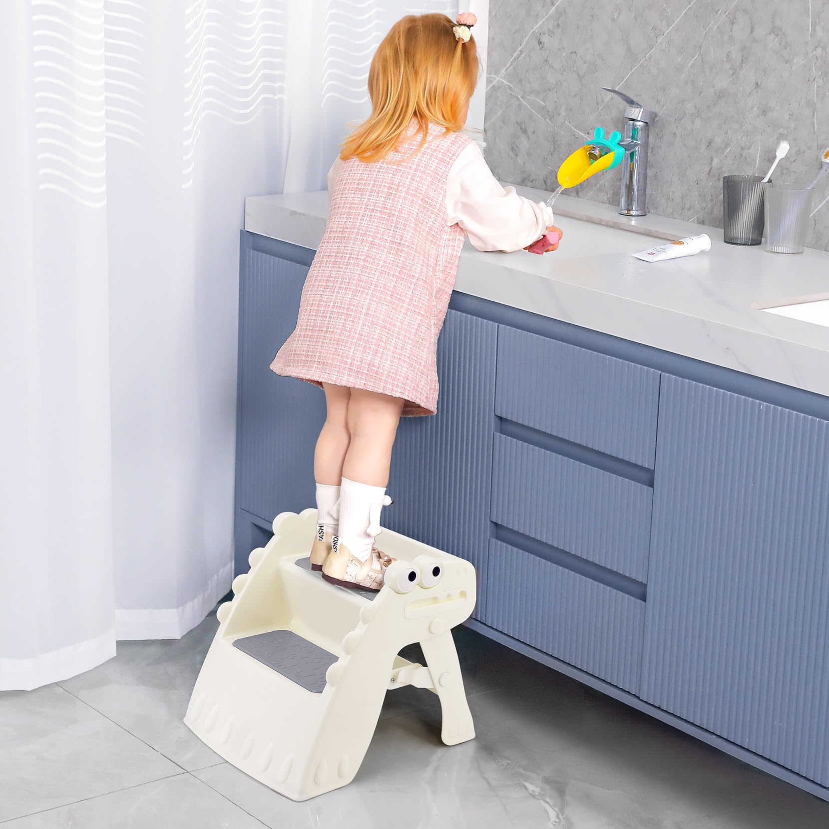 Onasti toddler step stool compact footprint fits small bathrooms.