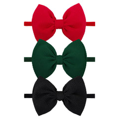 ONENINEDREAM Christmas headband set with red, green, and black bows adds festive outfit flair.