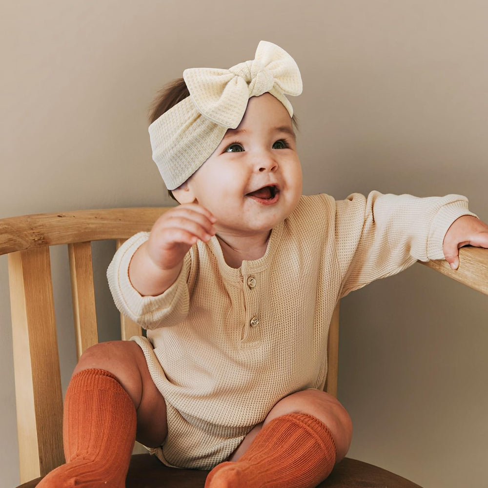 ONENINEDREAM soft fabric baby headband closeup highlights a gentle feel against delicate skin.