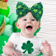 ONENINEDREAM St Patrick's headband closeup green bow nylon strap shows soft, stretchy comfort