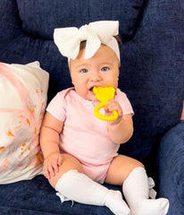 oogiebear 360° teether yellow side view demonstrates all-over bumps for comprehensive gum relief.