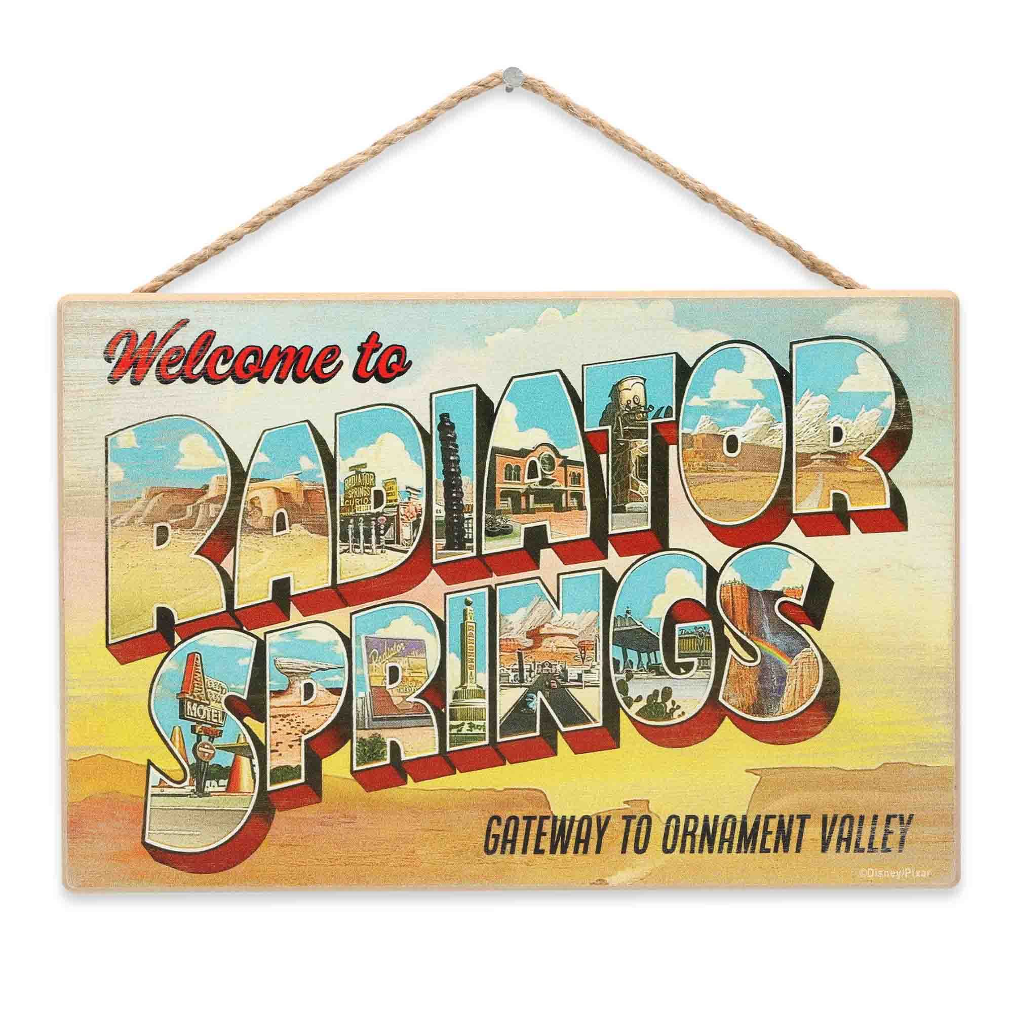 Open Road Brands Disney Pixar Cars Radiator Springs wall decor with sunset design for kids' rooms.