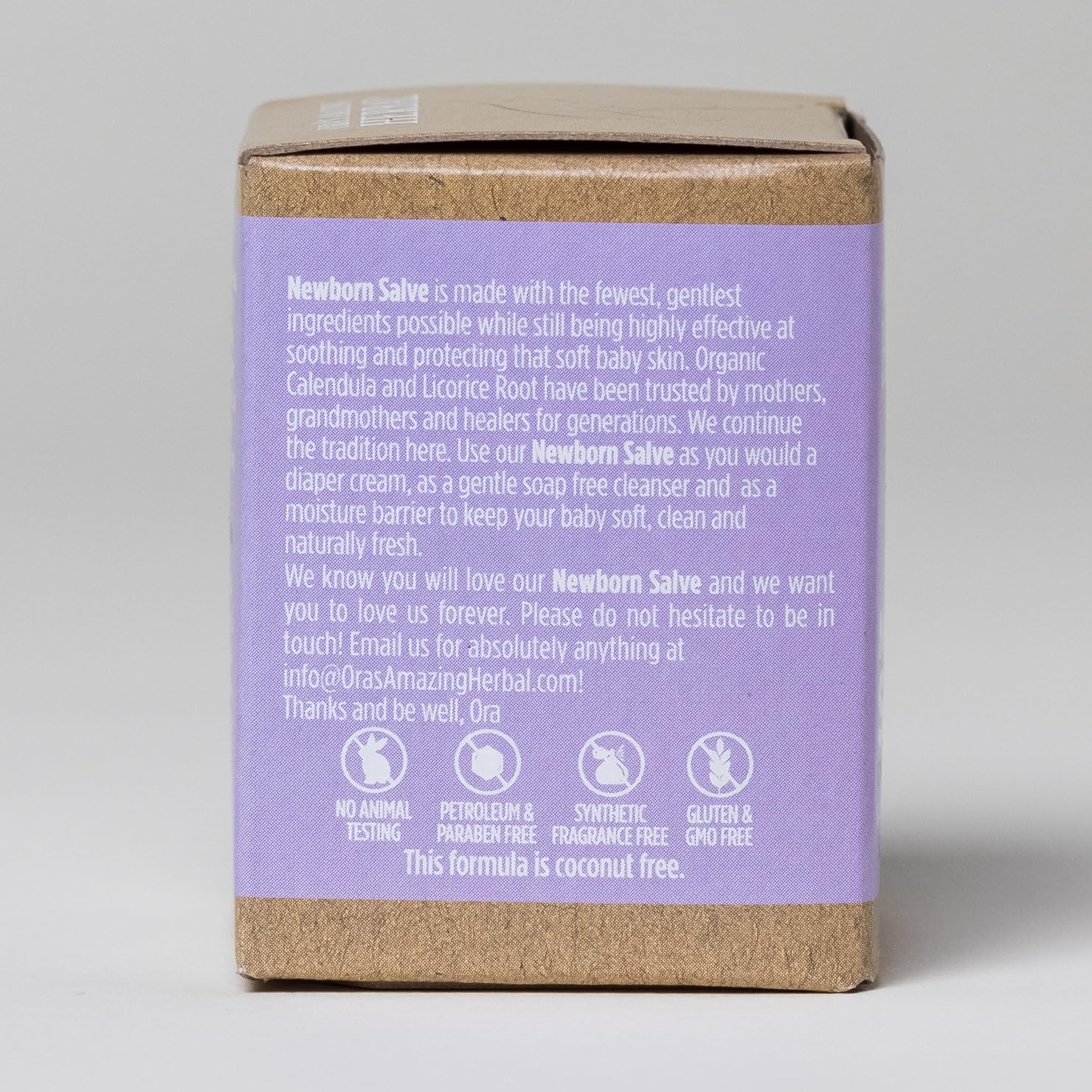 Minimal packaging and glass container emphasizing eco-friendly design of Ora's Amazing Herbal Newborn Salve