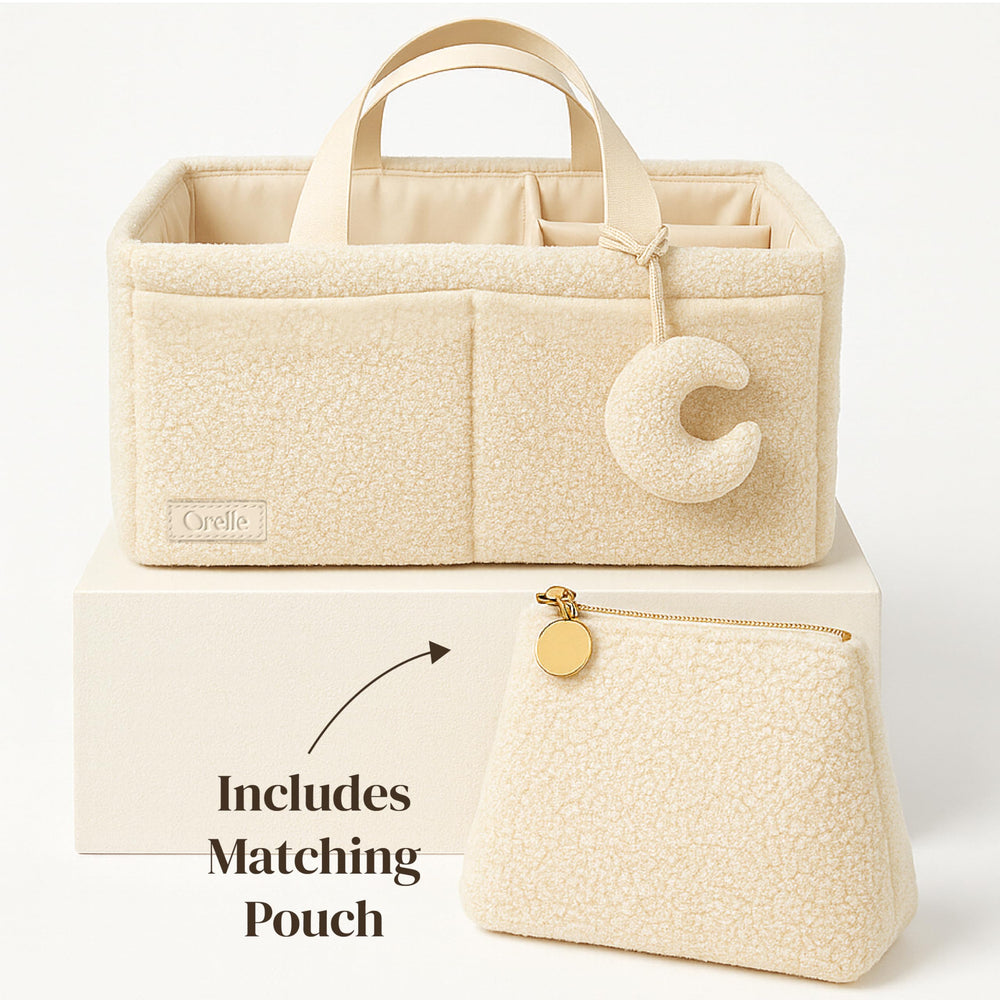 Orelle bouclé diaper caddy with 3 compartments keeps diapers, wipes, creams neatly organized