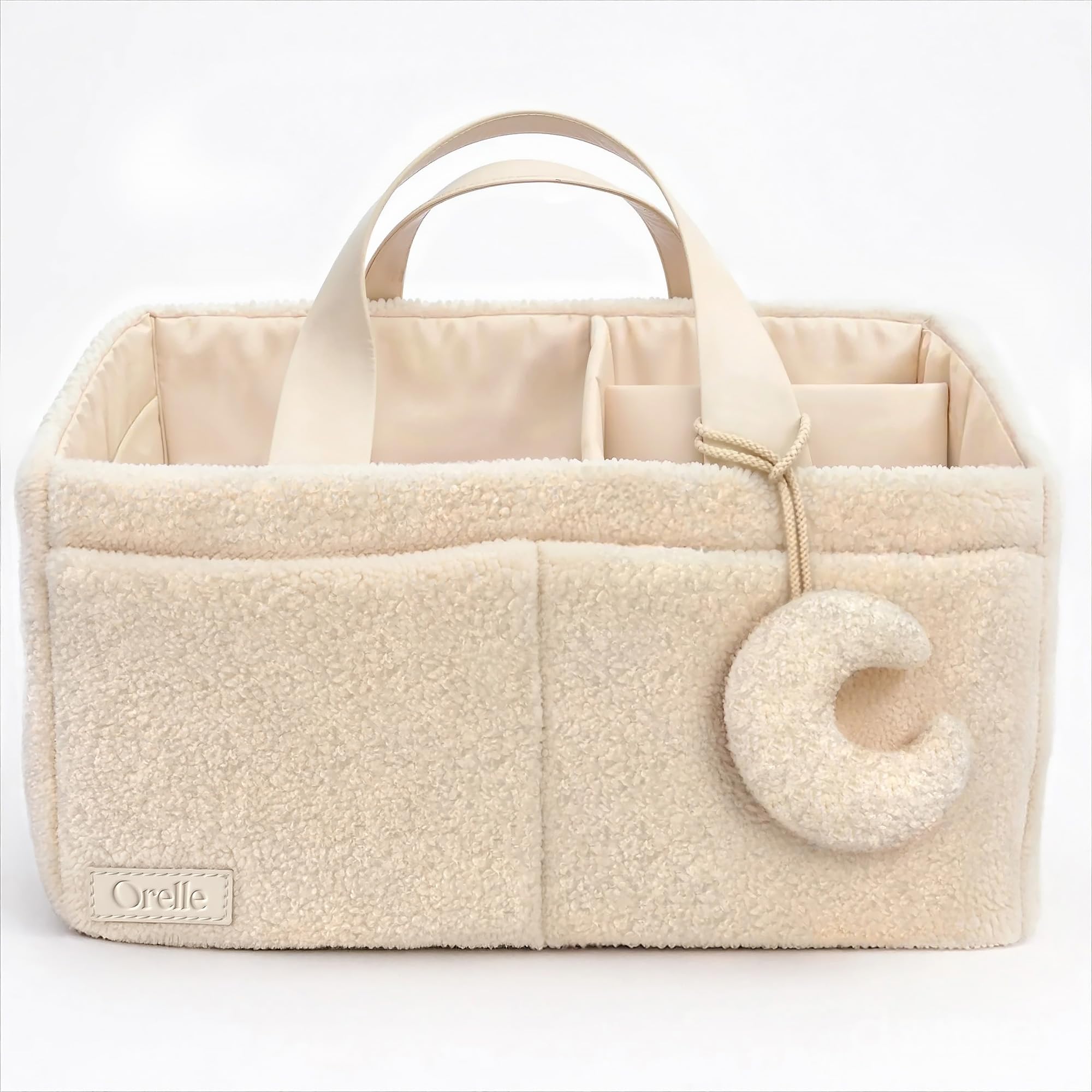 Orelle bouclé diaper caddy cream fabric closeup highlighting luxurious texture for nursery storage