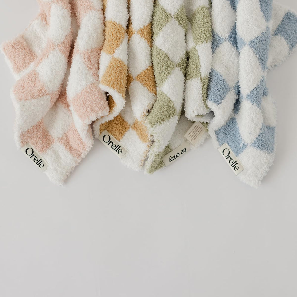 Orelle checkered lovey gift-ready packaging appeals to new parents and registries