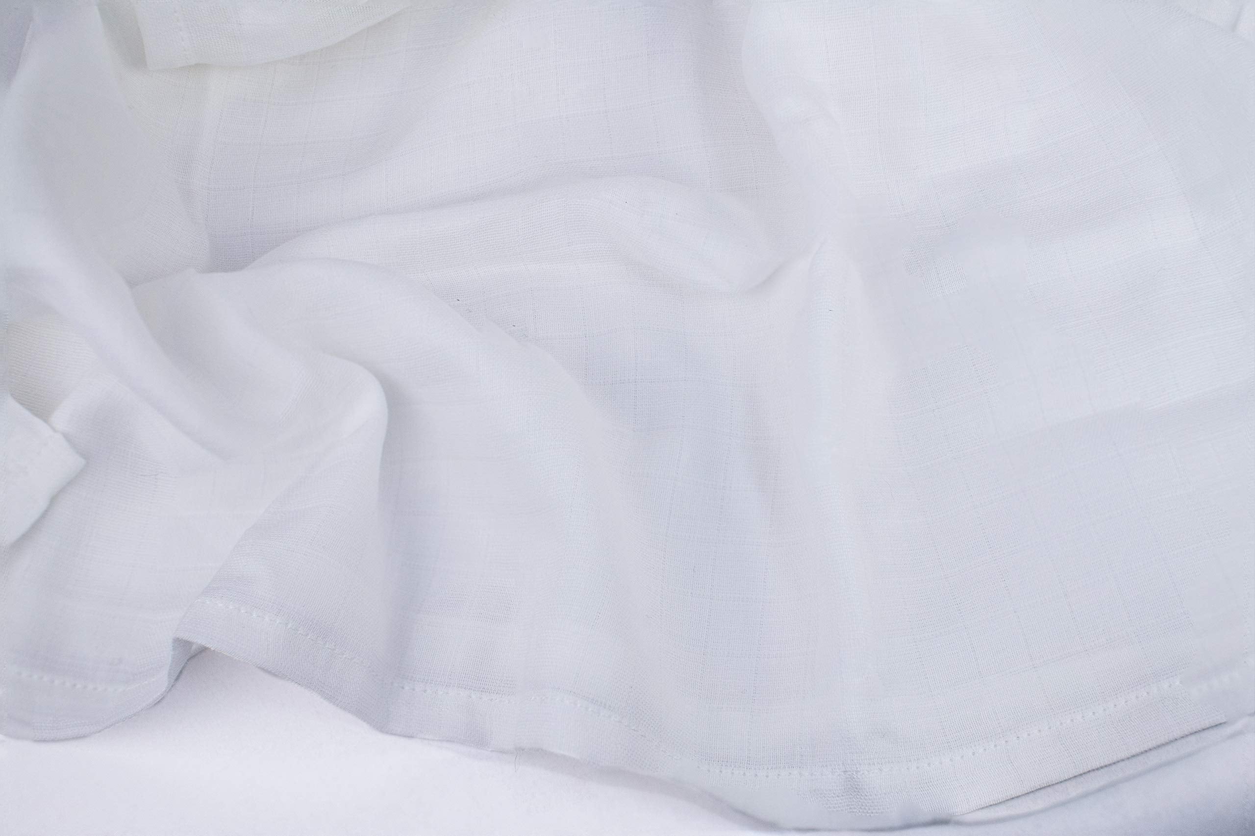 Organic Cotton Mart crib and nursery setup with versatile 47x47 blanket for cozy on-the-go use