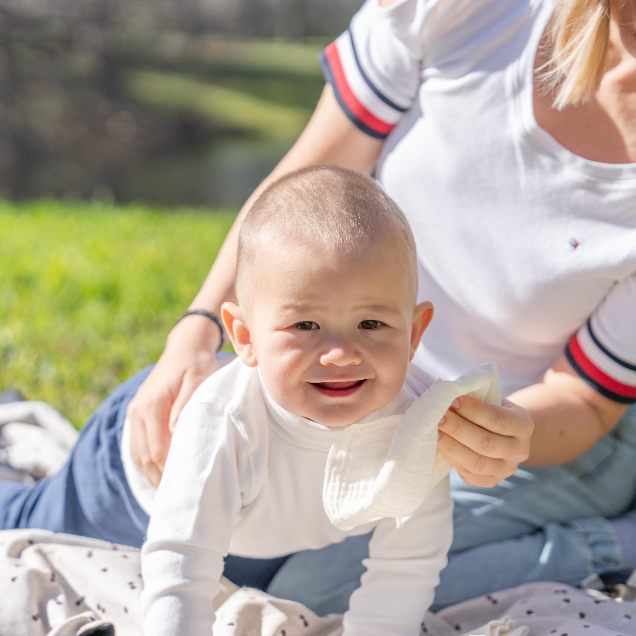 Organic Cotton Mart wipes in use during diaper change demonstrate gentle cleansing.
