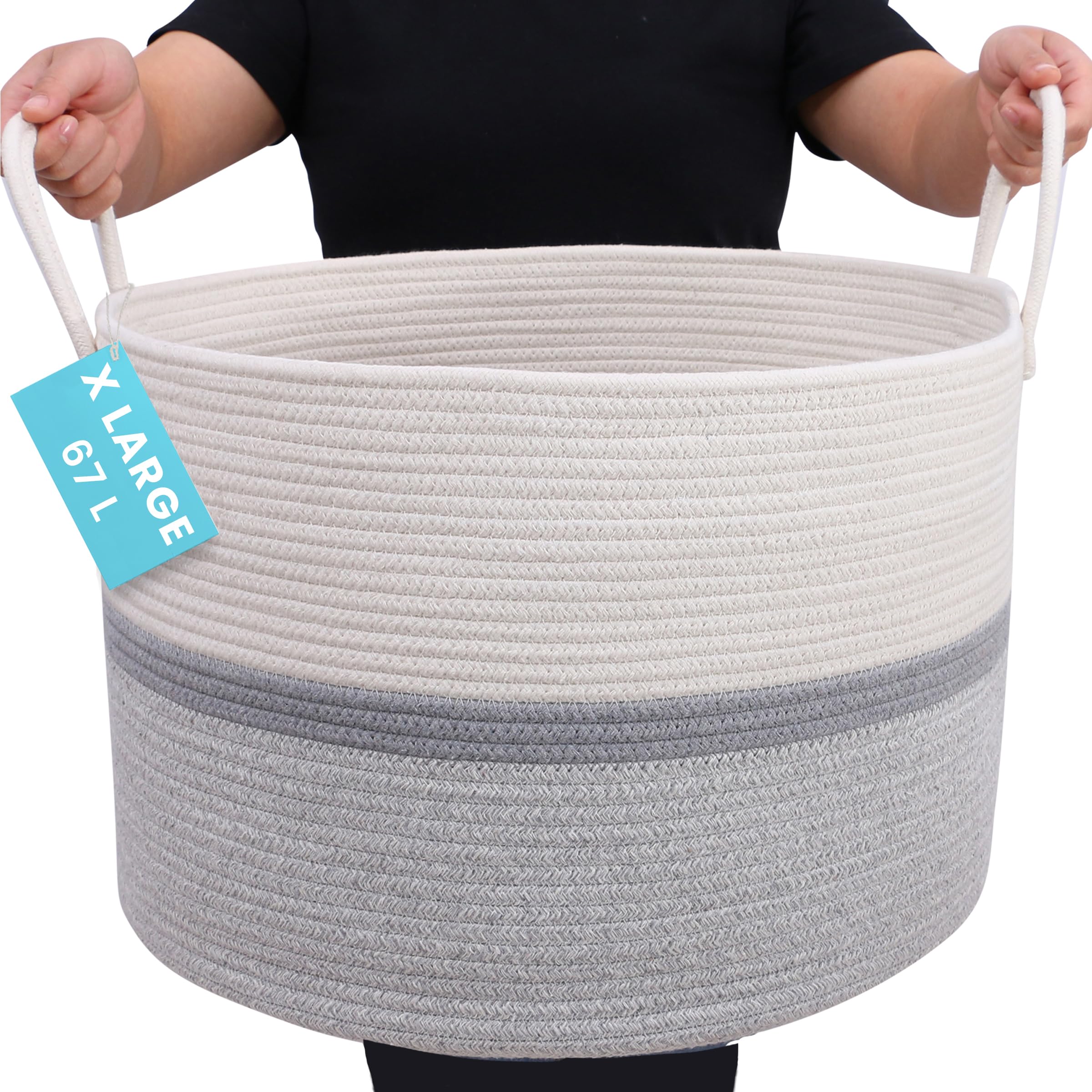 OrganiHaus large woven storage basket with gray stripe holds blankets neatly in living rooms.
