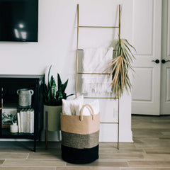 OrganiHaus laundry basket tall profile demonstrates tall form that keeps clutter out of sight.