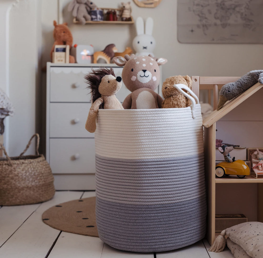 OrganiHaus nursery baby laundry hamper placed near changing station