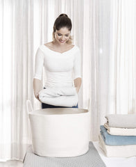 OrganiHaus nursery storage basket complements nursery decor while concealing soft items.