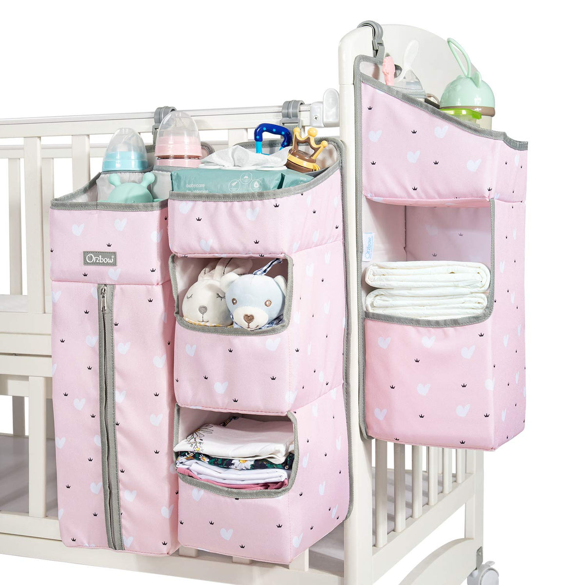 Orzbow 3-in-1 pink diaper caddy with three hanging pockets for baby essentials