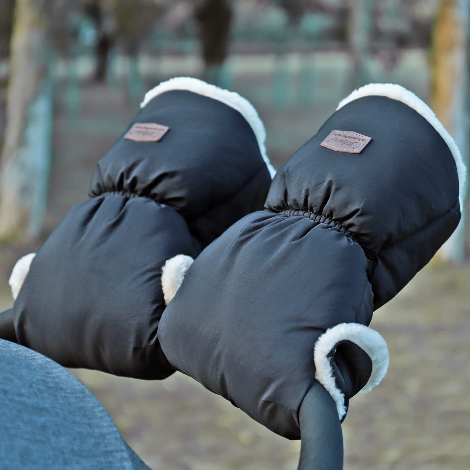 Orzbow black stroller mittens worn during a cold commute.