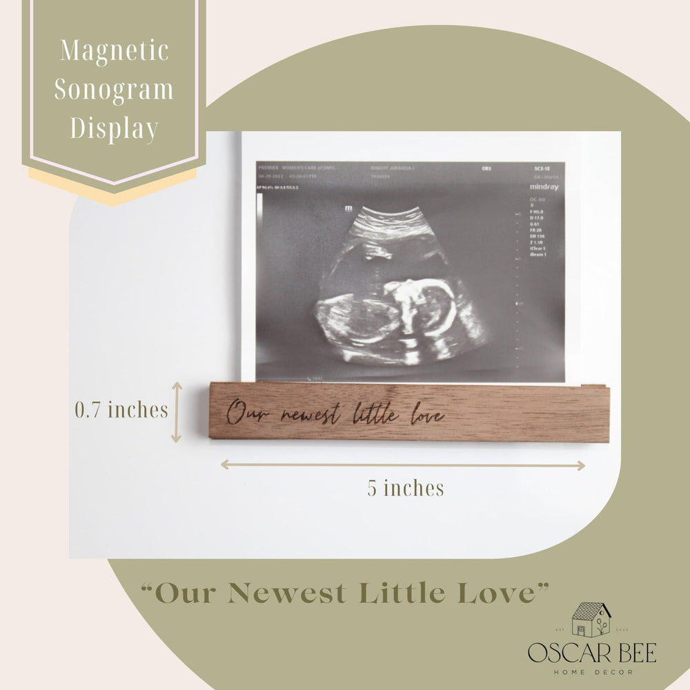 Oscar Bee baby-announcement frame supports 4x6 and 5x7 photos.