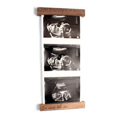 Oscar Bee sonogram frame in walnut finish highlights ultrasound keepsake for nursery decor.