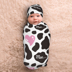 Osvbs cow-print swaddle blanket opened flat showing generous coverage