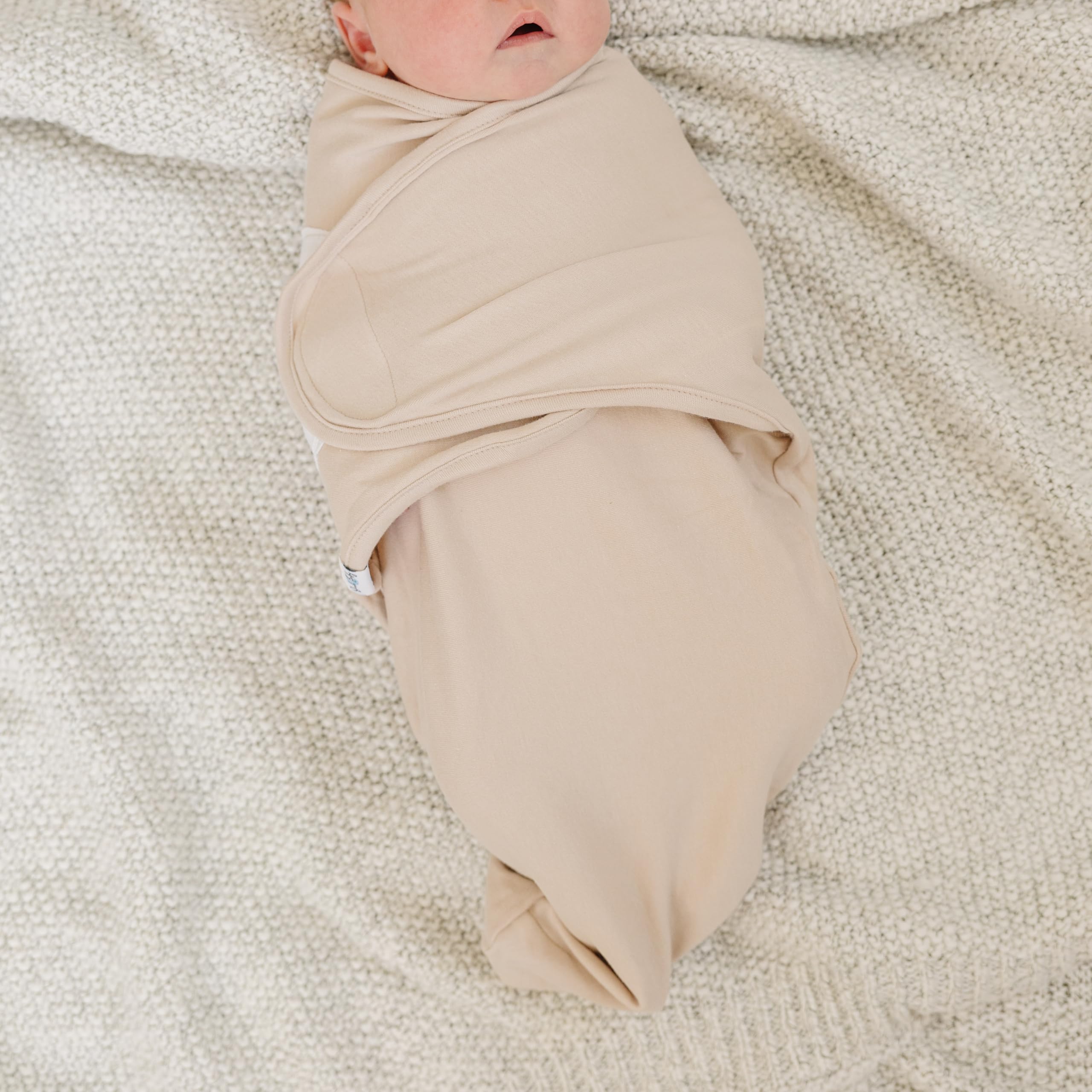 Ouch Baby organic cotton swaddle knit closeup showing breathable fabric for sensitive skin.