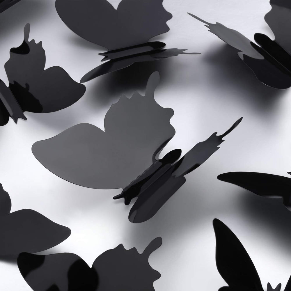 Outus removable butterfly wall decals in black for flexible decorating.