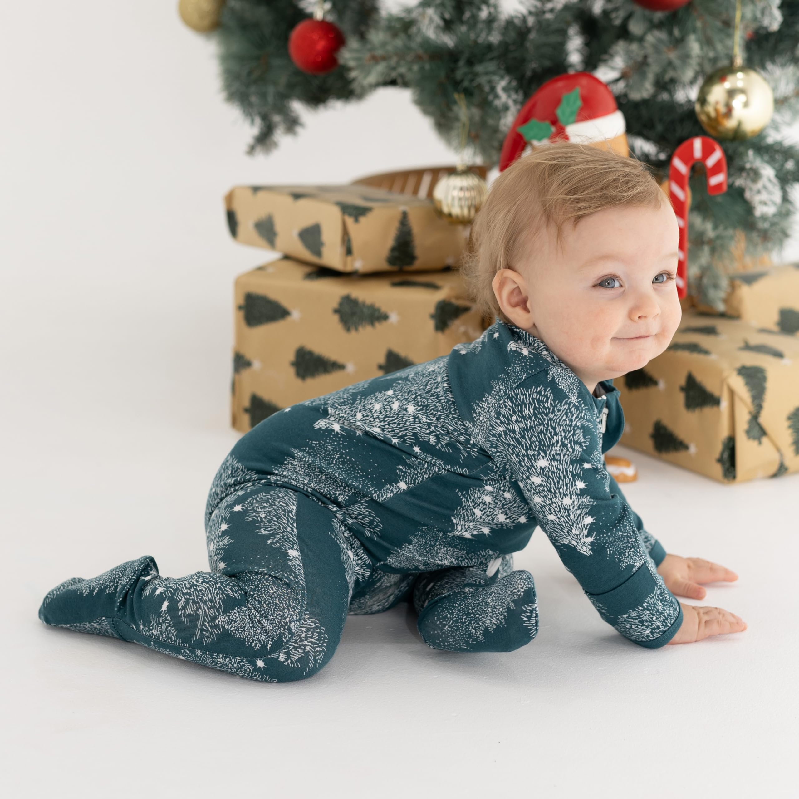Owlivia footed sleeper in Pine print keeps tiny feet warm